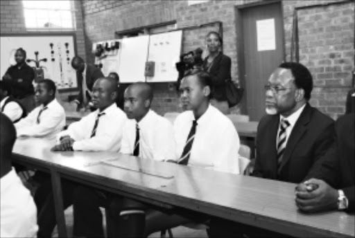 TOP OF THE CLASS: Deputy President Khalema Motlanthe sits in on a science lesson at Soshanguve "Technical High School, north at Pretoria. Pic. Peggy Nkomo. 19/01/2010. © Sowetan.