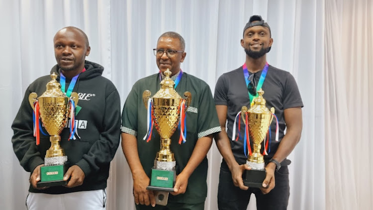 Patrick Gitonga (C) with Allan Oyende (L) and David Kimani (R) after dominating the podium during the ECASA Championships in Gaborone, Botswana