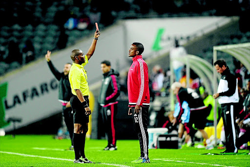OH NO!: Lehlogonolo Masalesa of Pirates is sent off from the bench in the MTN8 quarterfinal against Ajax Cape Town Photo: Sydney Mahlangu/ BackpagePix