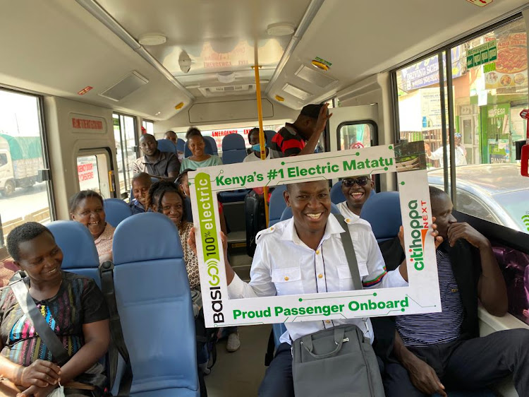 Passengers inside Basigo electric bus