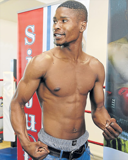 TALKING IT UP: Siphiwe Lusizi talks tough at the pre-fight medical ahead of his clash with Bongani Ngetshe at the Orient Theatre tonight. The southpaw is confident that his debut in the professional ranks will have a successful outcome Picture: SUPPLIED