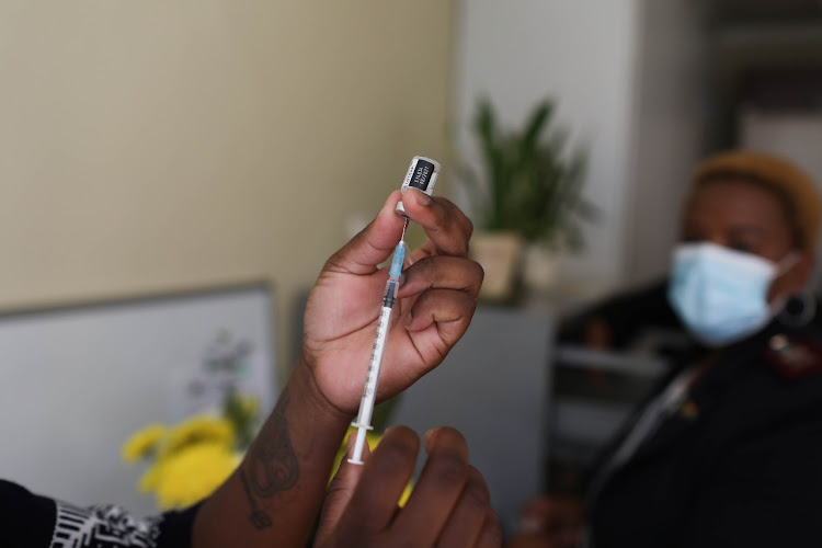 A healthcare worker prepares a dose of Covid-19 vaccine on the first day of the second phase of the vaccine rollout in SA.