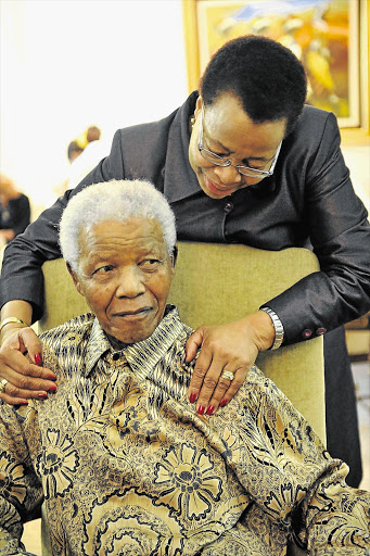 GRACIOUS COUPLE: Nelson Mandela at his home in Johannesburg with his wife, Graça Machel, in 2011