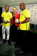 REWARDED:  Pitso Mosimane and  Khama Billiat - seen here with Absa's Matshepo Mazola - showing off their PSL  monthly awards yesterday Photo:  Sydney Seshibedi/Gallo Images