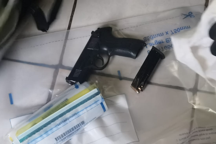 The police firearm and ammunition recovered after being stolen at an accident scene.