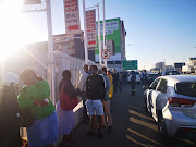 Scores of masked customers line up outside Liberty Liquors in Durban on Monday morning to get their hands on much-awaited alcohol. 