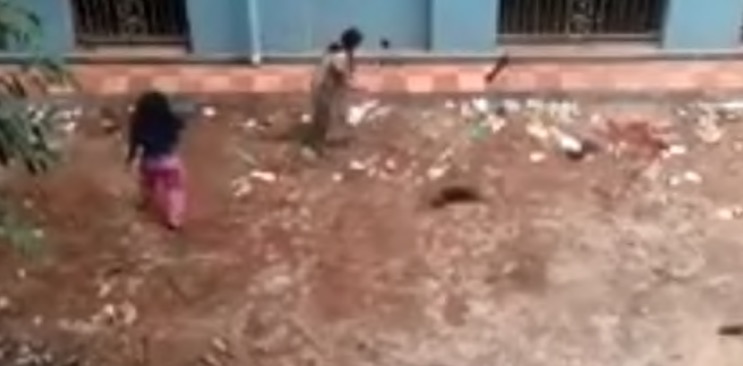 A screengrab from a viral video where two women are seen beating puppies in Kolkata, India.