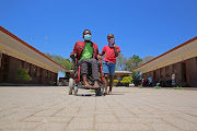 Itumeleng Swartland arrived at Mpongele Primary School in a wheelchair, accompanied by his son, Nana, where he was to cast his vote for the local government elections.
