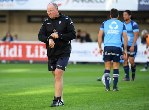 Montpellier's South African coach Jake White walks on the pitch ahead of the French Top 14 rugby union match between Montpellier and Castres on October 8, 2016 at Altrad Stadium in Montpellier.