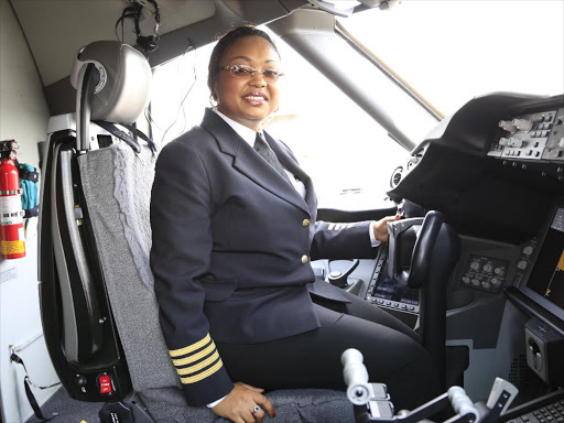 Kenya Airways Captain Irene Koki inside the Dreamliner at the JKIA /MICHAEL KHATELI