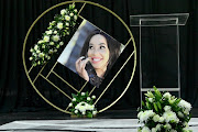 A picture of Mshoza alongside a flower arrangement for the star at her memorial service at Bassline in Johannesburg on November 25, 2020.
