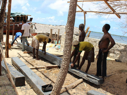 Dhow makers work on the dhow