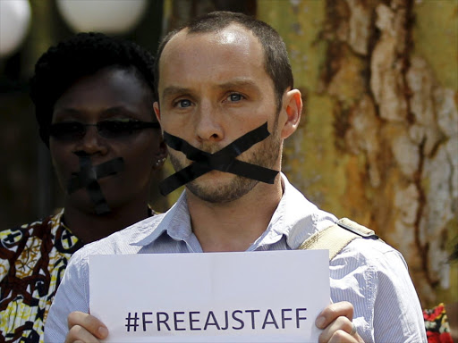 British photojournalist Phil Moore demonstrates against the imprisonment of three Al Jazeera journalists in Egypt, in a file photo. Photo/REUTERS