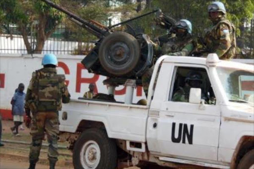 U.N. peacekeepers take a break as they patrol along a street during the presidential election in Bangui, the capital of Central African Republic, December 30, 2015. Photo/REUTERS