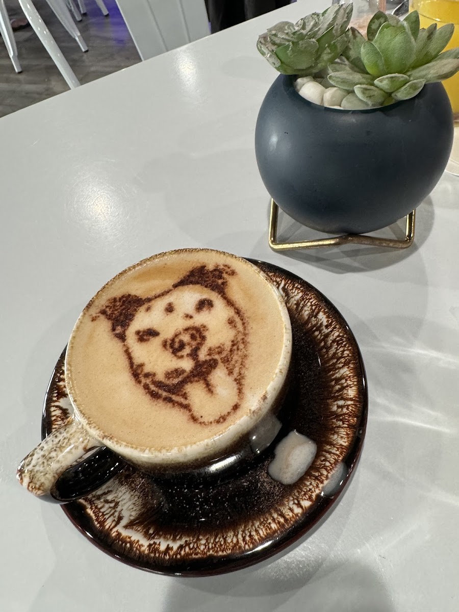 Cookie Butter White Chocolate Latte with Oat Milk & Blue Dog logo