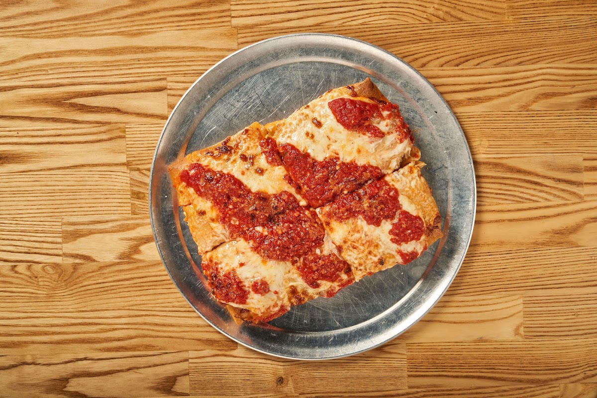 Gluten Free Sicilian Style Pizza, thick crust cooked in dedicated equipment.