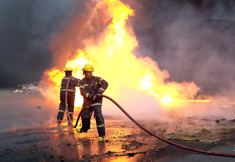Firefighters extinguish a fire