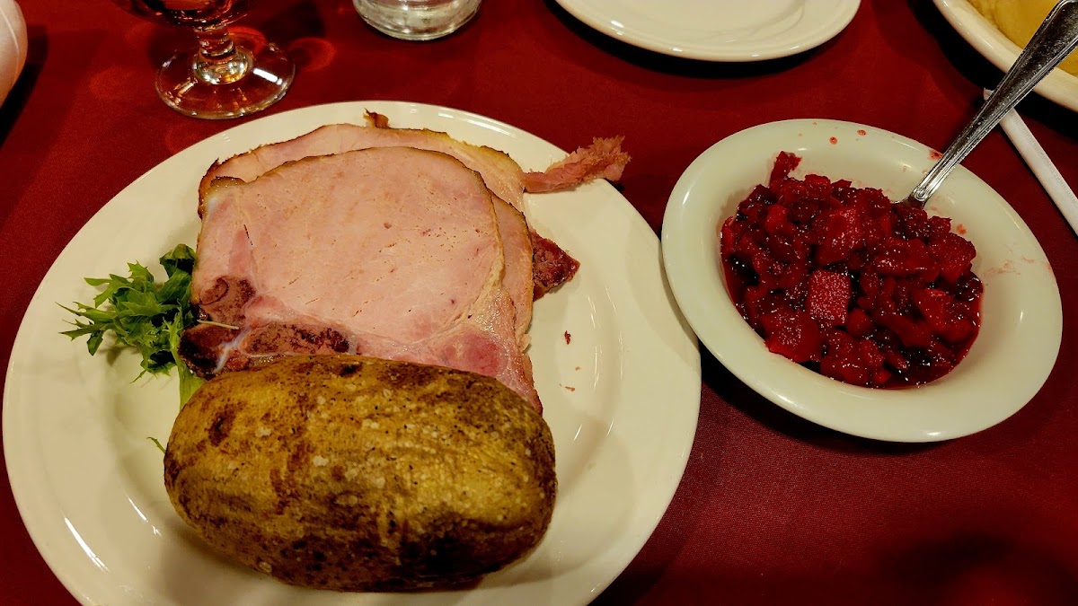 Smoked pork chops, plain baked potato and cranberry relish