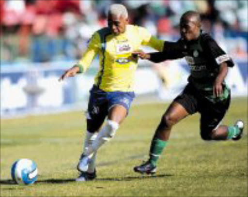 NO WAY: Sundowns' Vuyo More shelds the ball from Celtic's Siphesihle Ngobese in their SAA Supa 8 quarterfinal at Loftus on Saturday. Sundowns won 4-1. Pic. Veli Nhlapo. 12/08/07. © Sowetan.