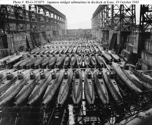 Japanese Type D ("Koryu") Midget Submarines In a drydock at Kure Naval Base, Japan, 19 October 1945