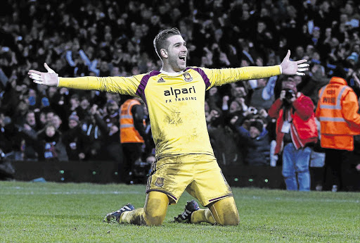 GLOVES OFF: West Ham's goalkeeper Adrian after scoring the winning penalty in the FA Cup replay against Everton on Tuesday night