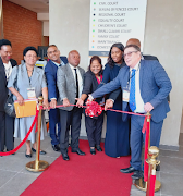 Deputy minister of justice and constitutional development John Jeffrey and other officials at the official opening and handover of the Chatsworth magistrate's court which received a R203m facelift by the department of public works. 