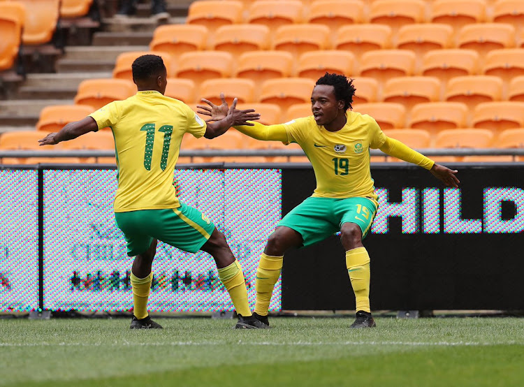 Former club teammates Percy Tau (R) and Themba Zwane (L) will be key attackers for South Africa at the Africa Cup of Nations finals in Egypt.