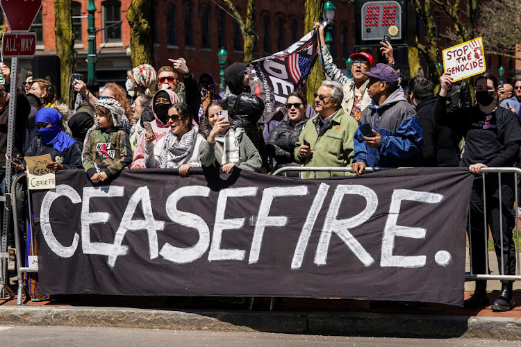 People protest near the Milton J Rubenstein Museum of Science and Technology where US President Joe Biden visits in Syracuse, New York, the US, April 25 2024. Picture: Reuters/Kevin Lamarque