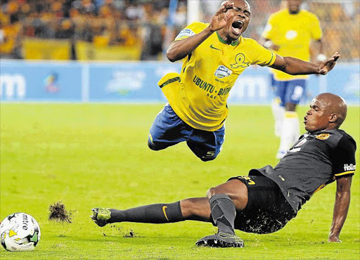 AIRBORNE: Asavela Mbekile of Mamelodi Sundowns flies after a heavy tackle from Tsepo Masilela of Kaizer Chiefs during their Telkom Knockout final played at Moses Mabhida Stadium in Durban last night Picture: GALLO IMAGES