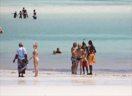 Tourists along Mombasa beach