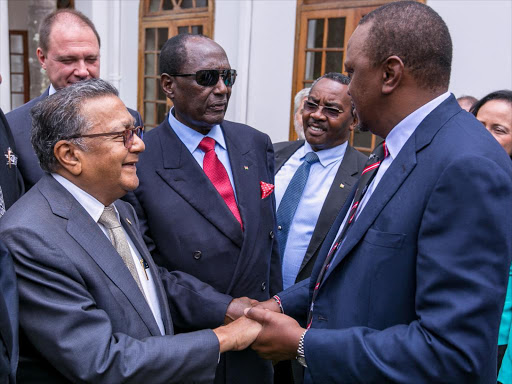 President Uhuru Kenyatta with businessmen Manu Chandaria and Chris Kirubi at State House, Nairobi, on Friday/ PSCU