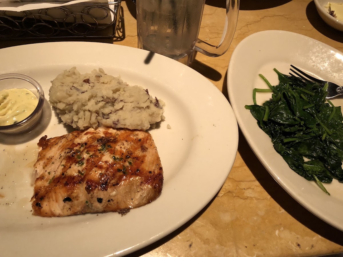 Grilled salmon with mashed potatoes and sautéed spinach
