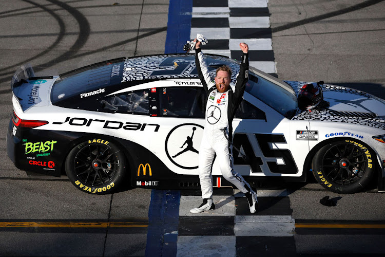 Tyler Reddick celebrates after winning the NASCAR Cup Series GEICO 500 at Talladega Superspeedway on April 21 2024 in Talladega, Alabama.