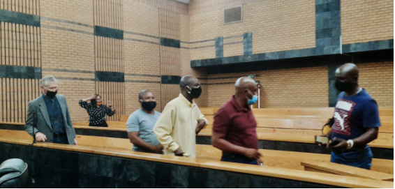 Five of the six accused make their way out of court following the postponement of the Marikana trial at the North West High Court on Friday.