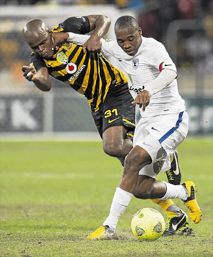 Willard Katsande of Amakhosi fights for the ball with Wits captain Sibusiso Vilakazi during the Nedbank Cup last 32 match on Saturday. Chiefs won 3-0