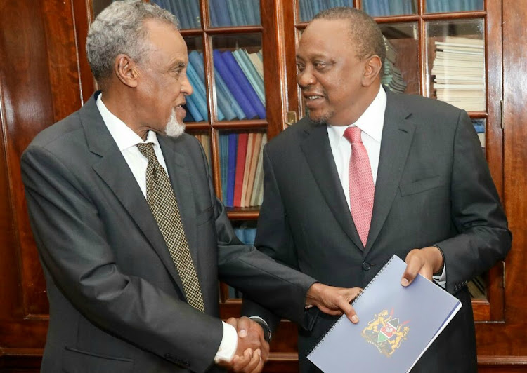 President Uhuru Kenyatta receives the BBI report from task force chairman Senator Yusuf Haji on November 27.