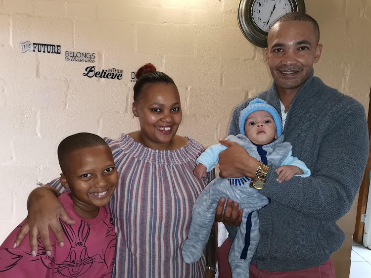After more than 100 days in neonatal intensive care, baby Ephraim Maleho is at home with brother Llyle, mother Beneline and father Melvory van Wyk.