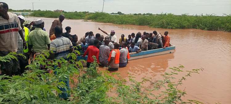 Passengers from Garissa aboard a boat at Kona Punda area in Madogo.