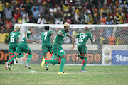 Players of Burkina Faso go into celebration mode after defeating Ghana on penalties in the semi final of the Africa Cup of Nations at Mbombela stadium, Nelspruit. PIC: SYDNEY SESHIBEDI. 06/02/2013. © The Times