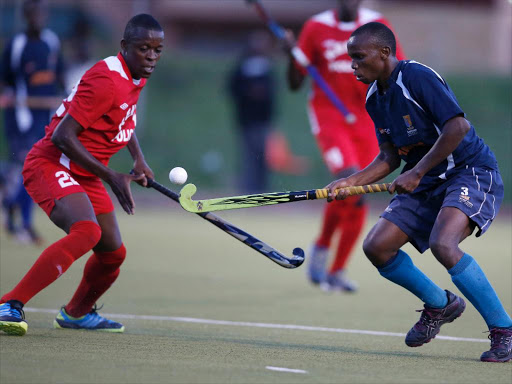 Marvin Kuru (L) of Kenya Police contests against Ian Shama of Strathmore University during their Premier League tie at City Park Stadium in Nairobi on November 14, 2015. The match ended on a goalless draw. Photo/file