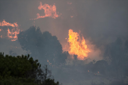 The fire rages on the mountainside around Glencairn.