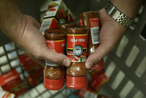 RED-HANDED: Staff at a supermarket in Durban’s Musgrave Centre remove spices from shelves.