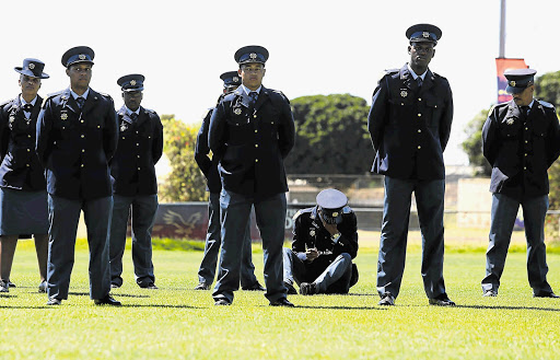 HEATWAVE BLUES: Some police officers succumbed to the heat during the handing over of the Sword of Command and long service awards ceremony in Parow yesterday.
