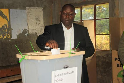 Andrew Maritim, People’s Patriotic Party of Kenya candidate for Nyangores MCA, casts his vote at Chebirir Primary School during the by-election, February 12, 2016. Photo/FELIX KIPKEMOI
