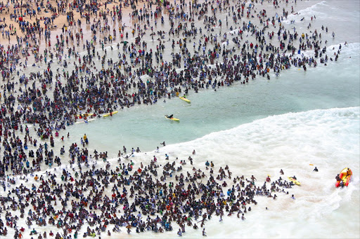 The Durban beachfront on New Year’s Day. Black people were barred from ’whites only’ South African beaches during apartheid.