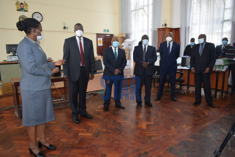 Presiding judge Lydia Achodhe narrates to the Chief Justice the benefits of the Court Tracking System (CTS) on July 2, 2020.