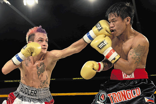 Hekkie Budler hits Filipino Renan Trongco with a left at Emperors Palace at the weekend on his way to a convincing unanimous points win