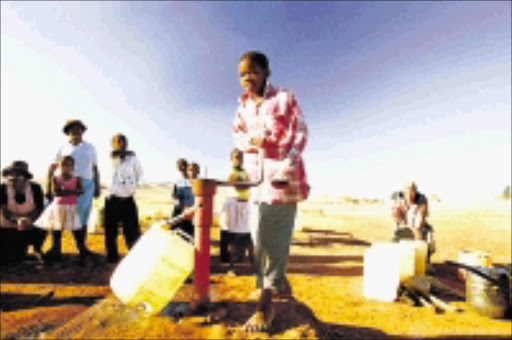 BAD SITUATION: Residents of Nsukazi outside Ulundi share one tap. They blame the government for failing to deliver on its promises. 13/05/2009. © Sowetan.
