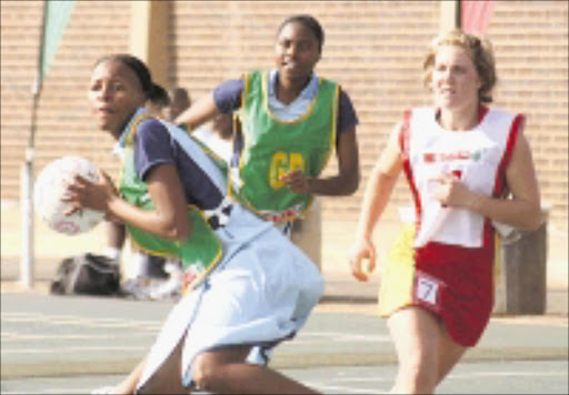 SETTING UP: Sekhukhune, in green bibs, playing against Northwest Central at the National Netball Championships at the University of Pretoria. Pic. Vathiswa Ruselo. 04/08/08. © Sowetan.