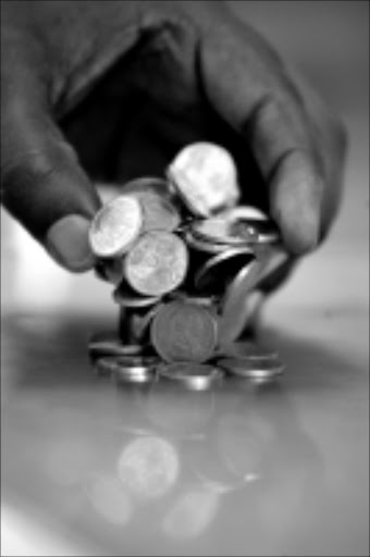 TAKE FIVE: Five cent pieces appear to be reviled by consumers - but are still legal tender. Pic. Antonio Muchave. 19/10/08. © Sowetan.